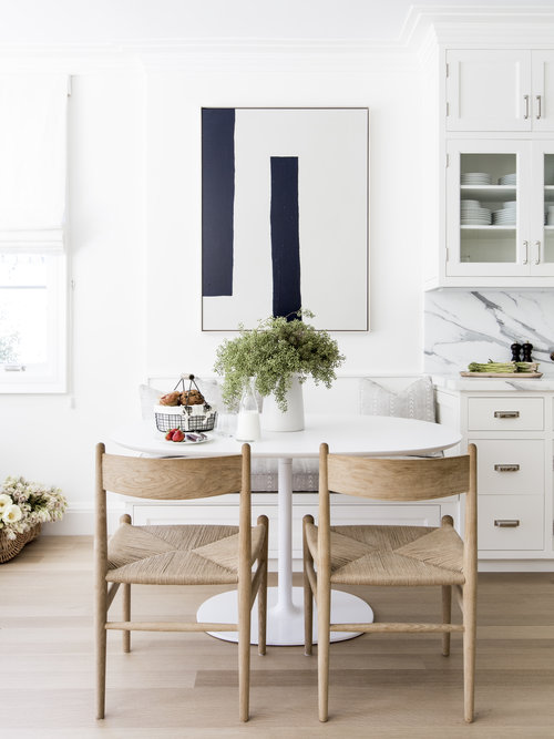 White and wood kitchen with marble countertops and backsplash and modern art and furniture-Alyssa Kapito - favorite pins of the week