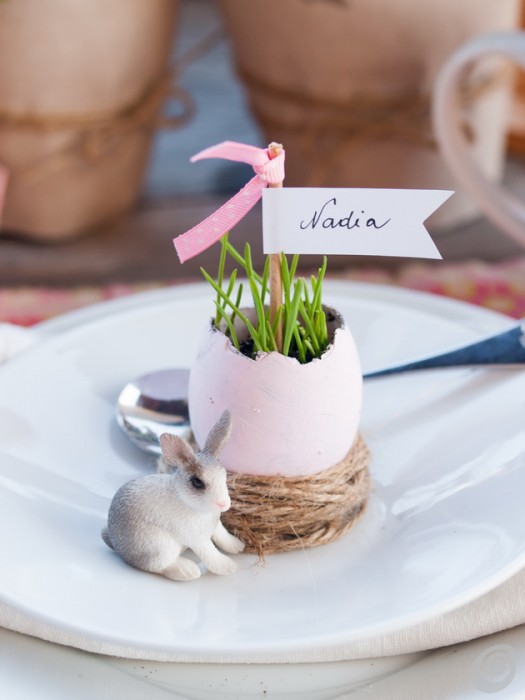 This sweet display, with fresh grass sprigs, tiny nests, and personalized place settings, would be the perfect way to welcome your guests for Easter! easter table - easter decor - spring decorating ideas - table setting 