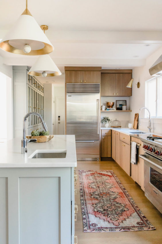 Beautiful modern kitchen with light wood cabinets, white walls and vintage rug - kitchen ideas - kitchen remodel - kitchen design - rehabitat interior design