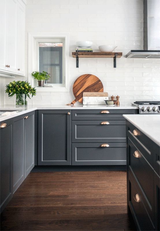 Love this beautiful kitchen design with dark gray lower cabinets and white upper cabinets and brass pulls - kitchen remodel - gray kitchen cabinets - kitchen ideas - kitchen decor - modern kitchen
