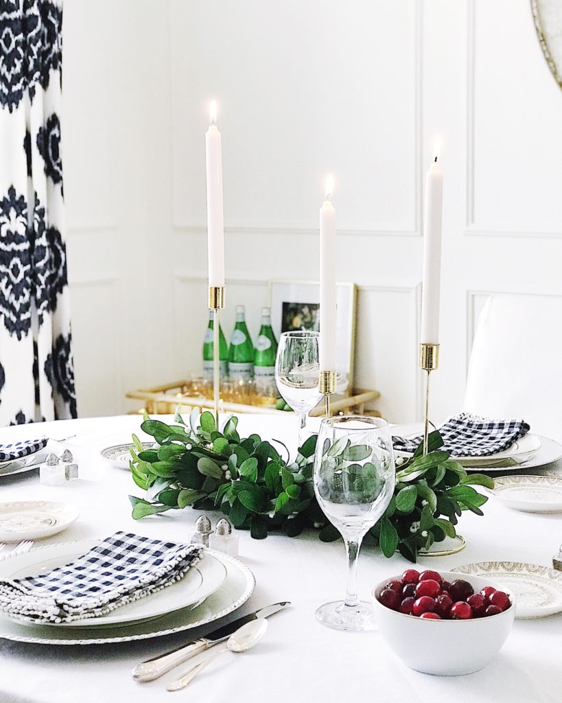 Are you hosting Christmas dinner or another holiday event this year? You'll be inspired by these beautiful Christmas and holiday table setting ideas!Easy blue and white Christmas decorating ideas - holiday table idea
