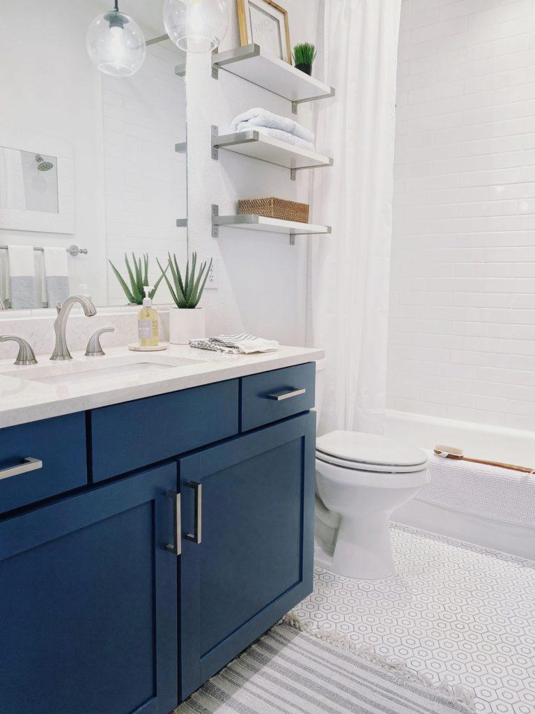Blue and white guest bathroom with tips on how to paint bathroom cabinets - bathroom ideas - bathroom remodel - diy - bathroom renovation - bathroom decor - bathroom design - blue bathroom vanityjane at home