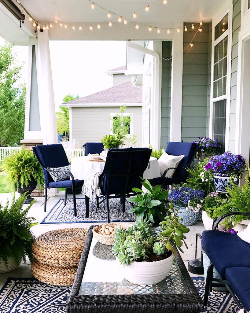 Patio idea - blue and white outdoor rug and decor with string lights - Jane at Home - #patio #patiodecor #porchideas #homedecor