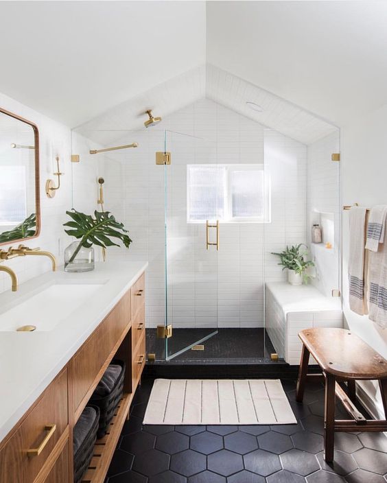 Beautiful bathroom design ideas, including bathroom vanities, bathroom decor, lighting, and more! Natural wood vanity, black tiled floor and white tiled shower surround Casework