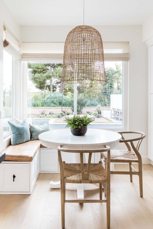 Beautiful breakfast nook idea for cozy kitchen dining with woven pendant light and wishbone chairs - Pure Salt Interiors #dining #breakfastnook #kitchennook #nook