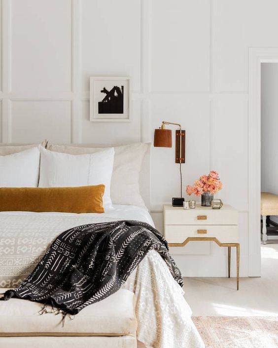 Gorgeous bedroom design with warm tones and velvet lumbar pillow | lisa tharp