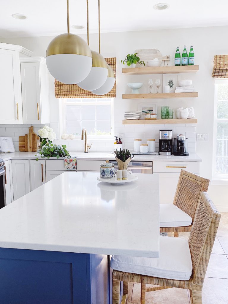 Blue and white kitchen design including Serena and Lily rattan counter stools - jane at home
