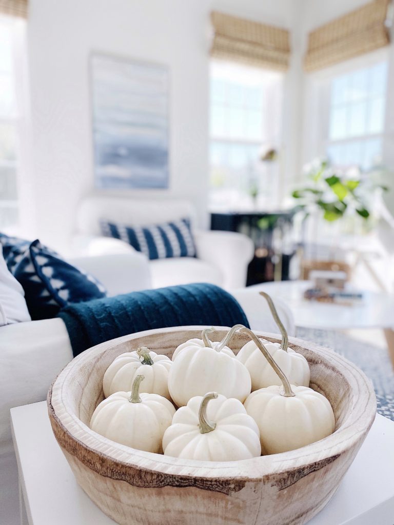 Blue fall decor: how to decorate your home for fall with blue - jane at home #falldecor #bluedecor #coastaldecor #falldecoratingideas #coastalstyle #fallpumpkins #whitepumpkins