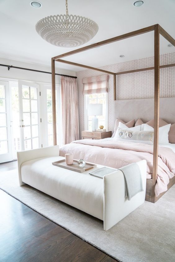 Lovely feminine bedroom design with canopy bed and blush accent colors
