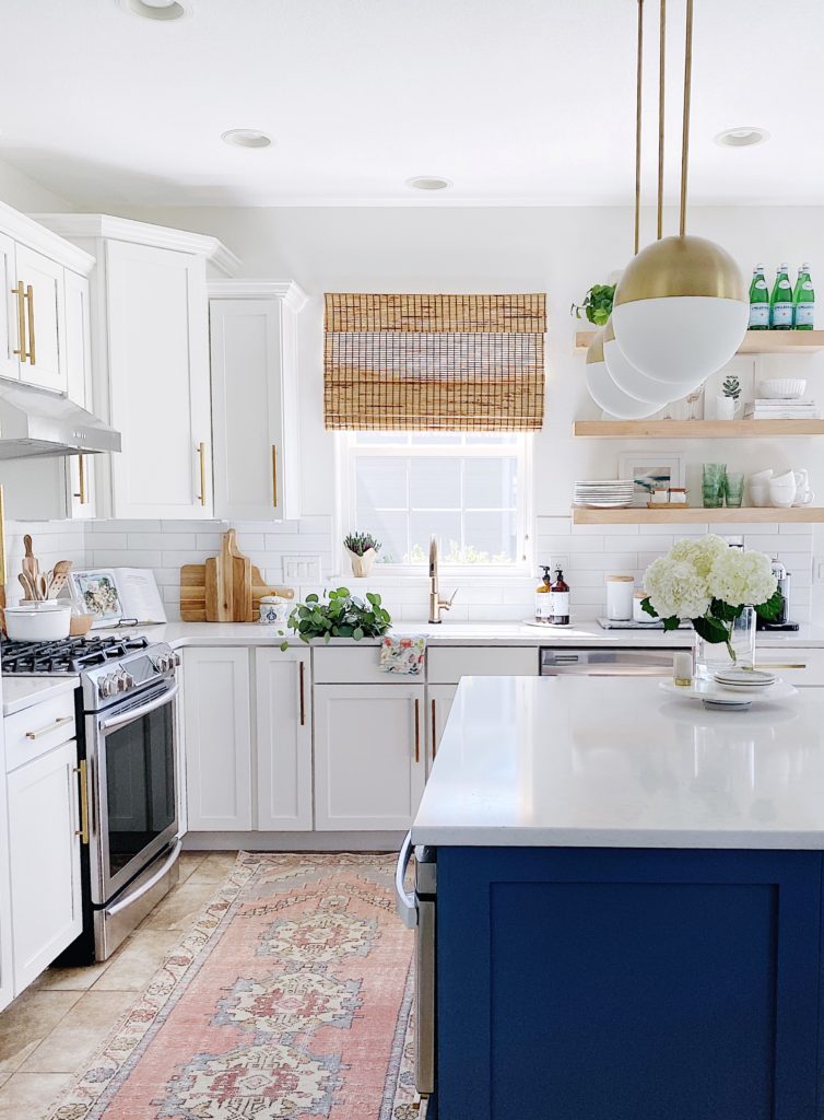 Loving how light and bright our kitchen feels since we painted all the cabinets, walls and ceilings white, using White Dove by Benjamin Moore - jane at home #kitchen #lighting #paint #palette #white #blue