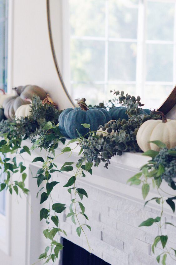 Blue and white pumpkins and greenery on the mantel #falldecor #mantel #mantle