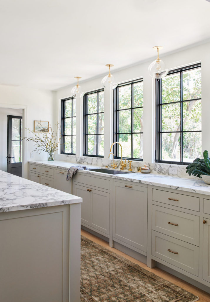 Beautiful timeless kitchen with gray cabinets and brass finishes - amber interiors - tessa neustadt