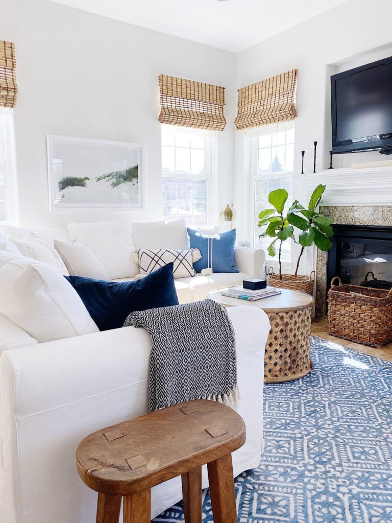 Cozy decorating ideas for the living room and mantel - jane at home #livingroomdesign #coastalstyle #coastaldecor #livingroomideas #fireplacedecor #mantle