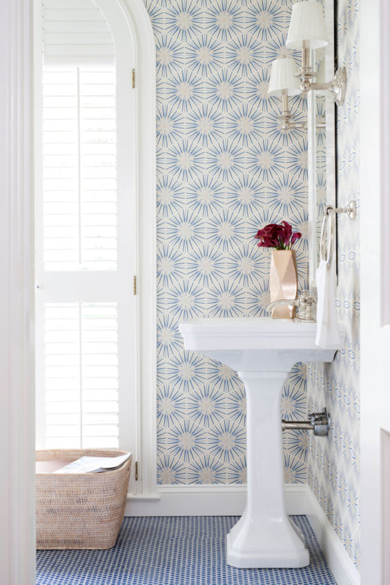 Love the beautiful wallpaper in this charming powder bath!