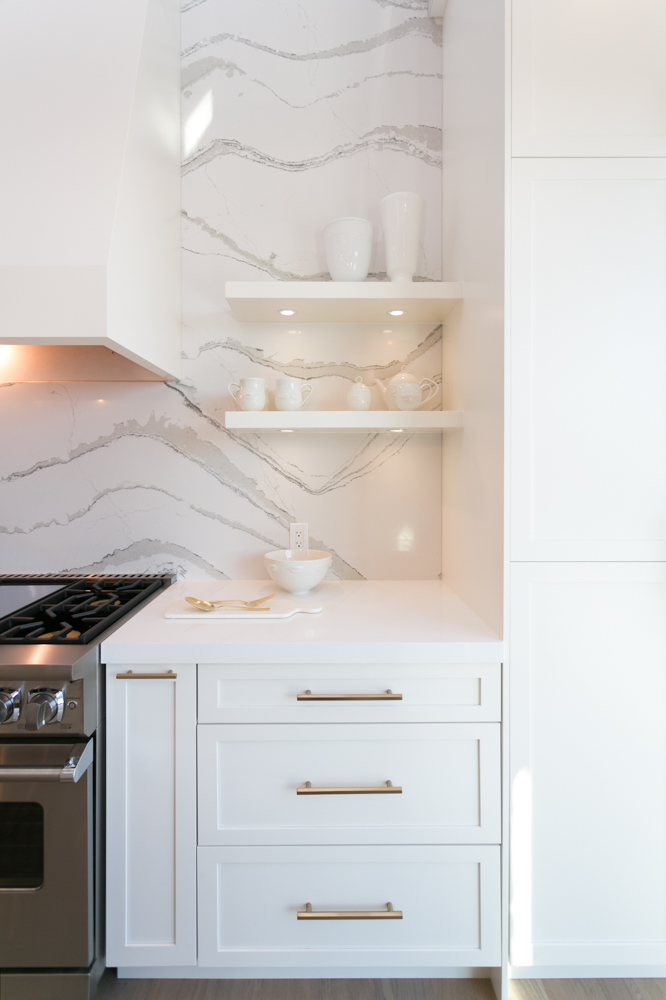 Beautiful marble kitchen backsplash with white open shelving