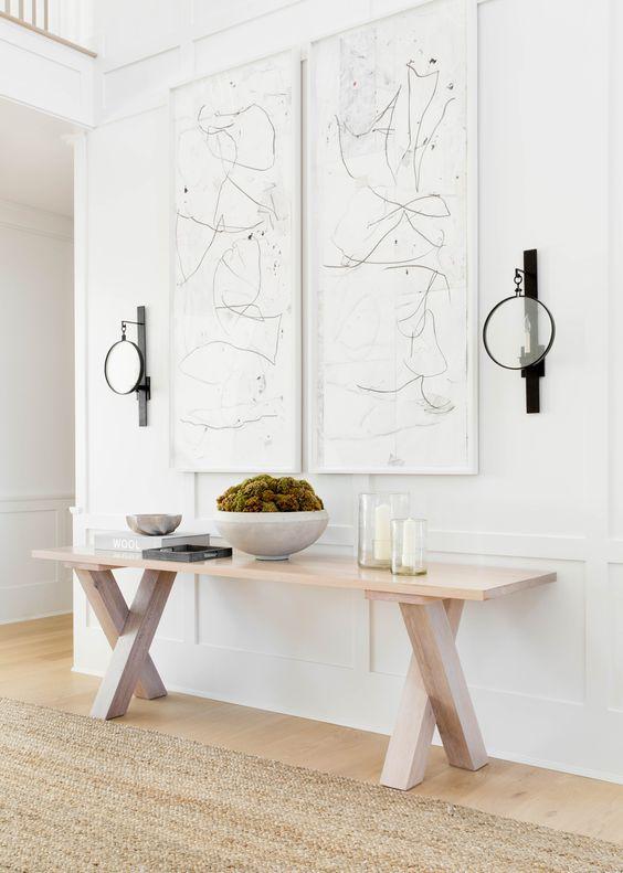 Love this beautiful contemporary entryway design with a wood console table and modern artwork - quiet luxury - tamara magel