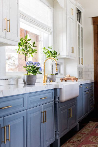 Styling tips for the kitchen - beautiful fresh flowers and topiaries in a blue and white kitchen #home #style #design #ideas Becki Owens