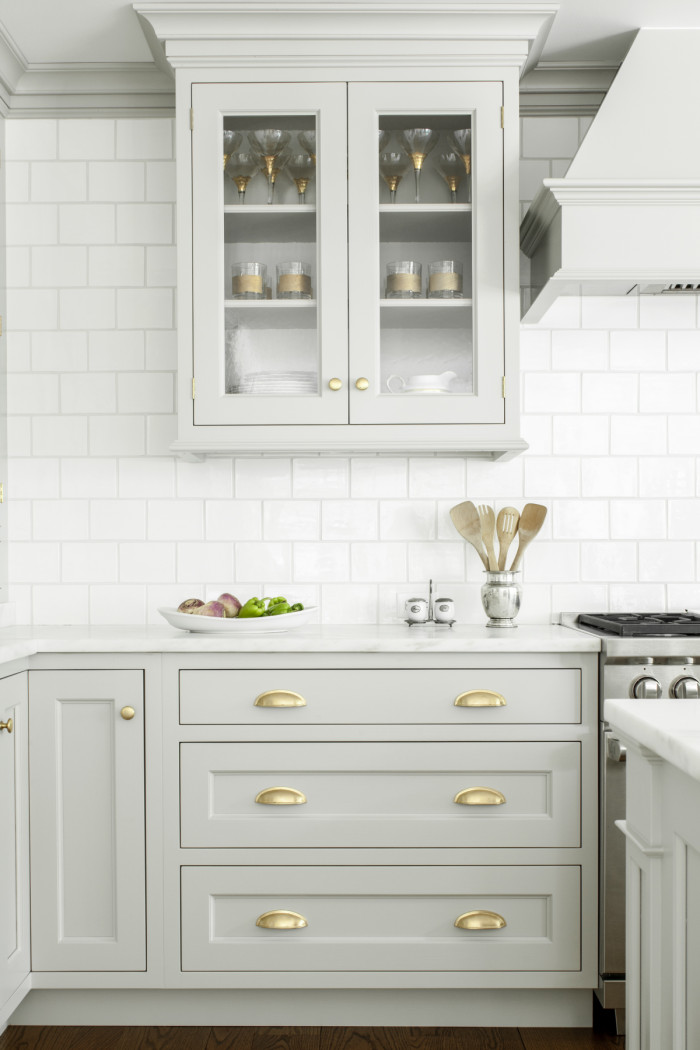 I love this gorgeous timeless kitchen design with gray cabinets, a white subway tile backsplash, and brass pulls- beautiful kitchens - kitchen cabinet ideas - gray kitchens - grey kitchen - kitchen cabinet colors - Heidi Piron Design