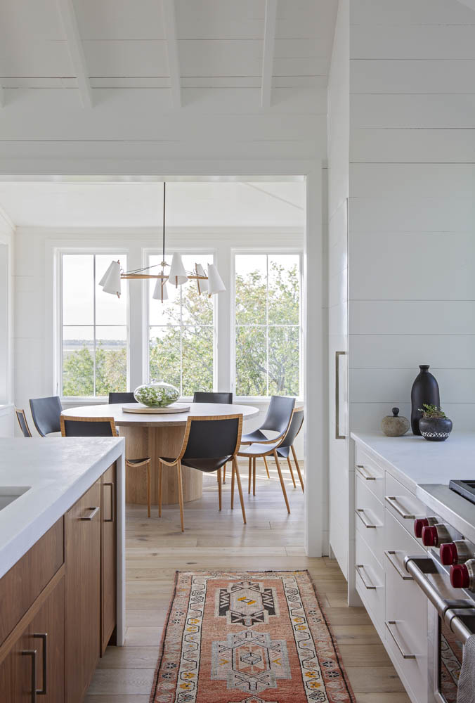 Beautiful spaces of the week: beautiful modern kitchen design and attached modern dining area - jenny keenan design #kitchendesign #oushakrunner #diningroom #diningideas