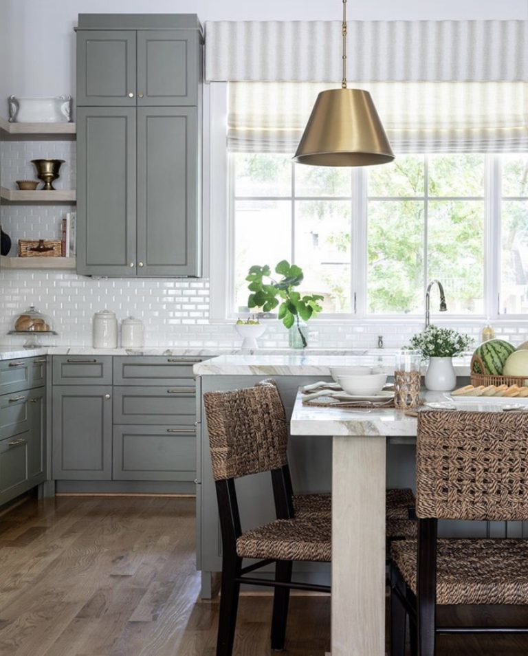 Stunning kitchen design with dark green cabinets, marble backsplash, brass lighting and custom range hood - kelsey leigh design