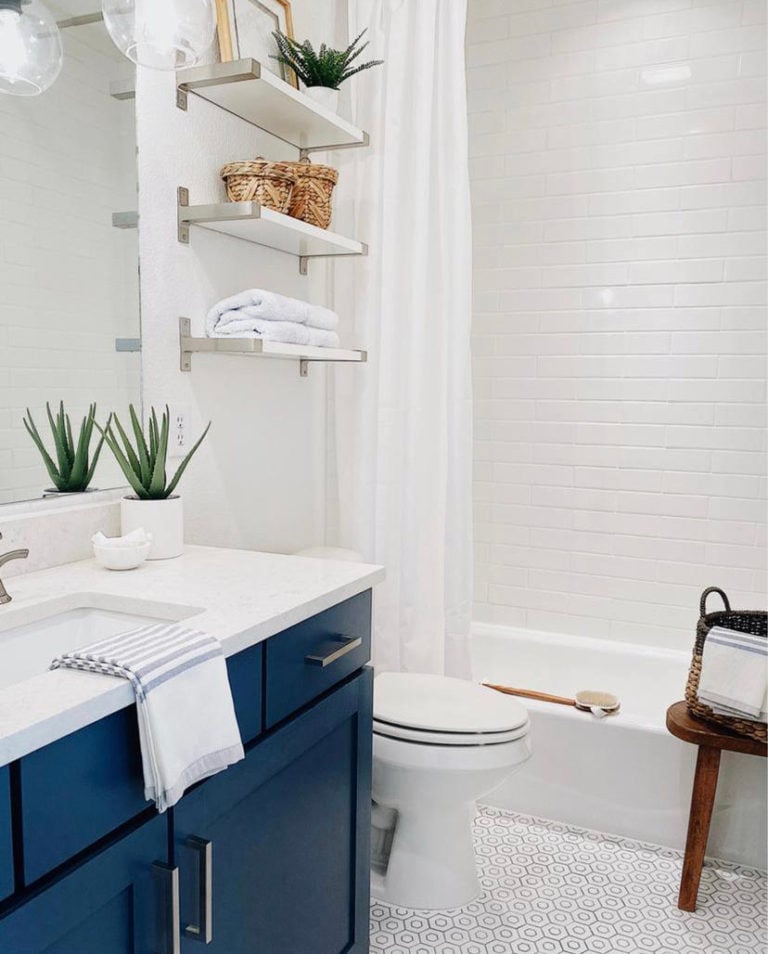 Our budget guest bathroom remodel, including how to paint bathroom cabinets - easy and budget friendly diy bathroom remodel tips - jane at home - van deusen blue benjamin moore - bathroom makeover - before and after - blue bathroom - diy bathroom remodel