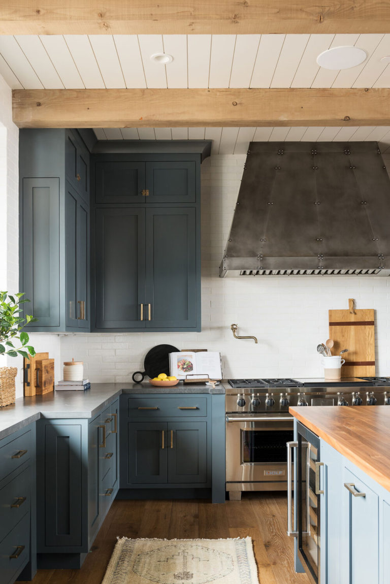 Beautiful dark blue kitchen cabinets with butcher block counter top