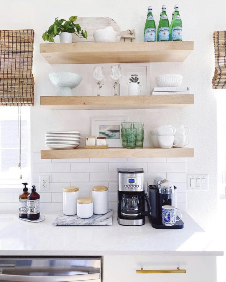 Open shelving in the kitchen with white quartz countertops, subway tile backsplash, white cabinets with gold hardware - jane at home