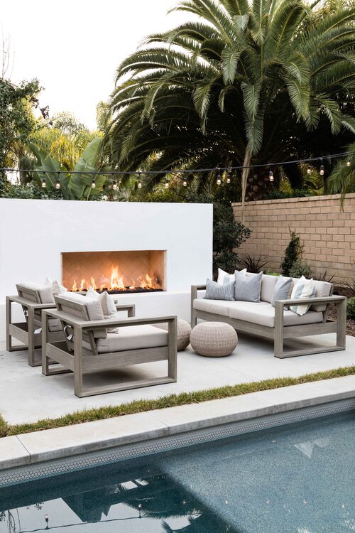 Beautiful backyard patio, swimming pool, outdoor seating area, and fireplace 