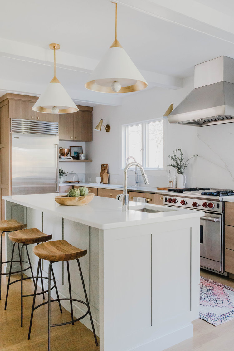 Beautiful modern kitchen design with light wood cabinets and gray green kitchen island - Rehabitat