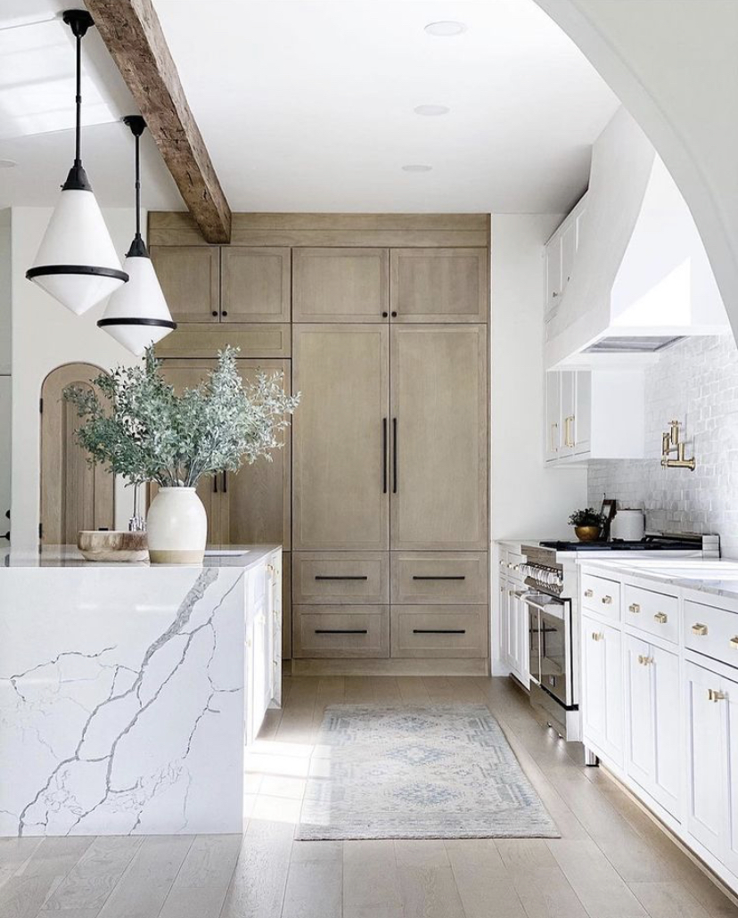 Beautiful kitchen remodel with waterfall countertops on kitchen island - Vivir Designs Instagram