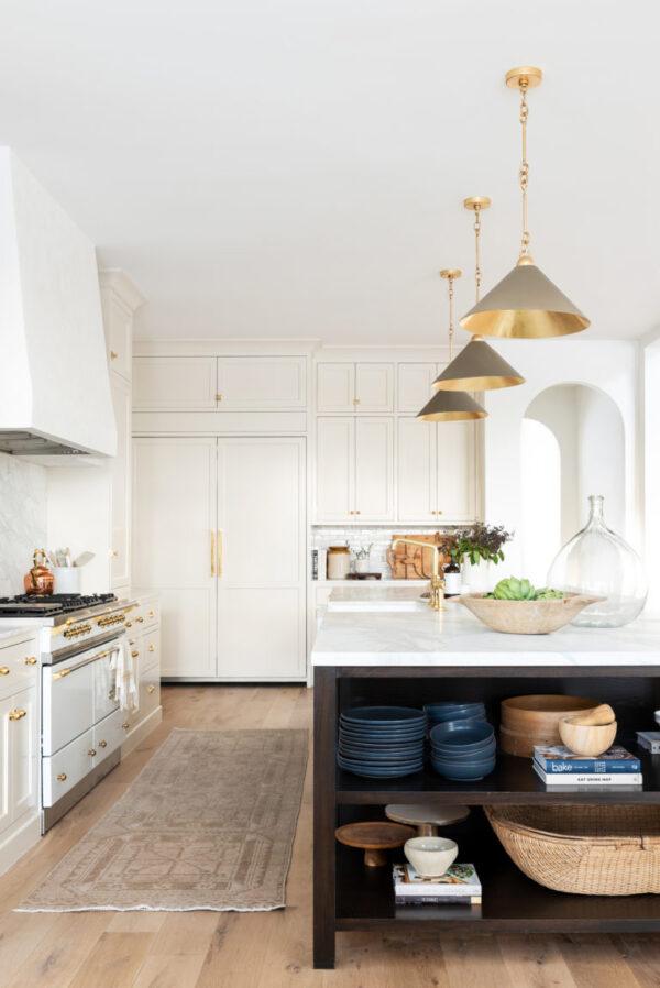 Love this beautiful contemporary kitchen design with white cabinets and a dark wood kitchen island - studio mcgee