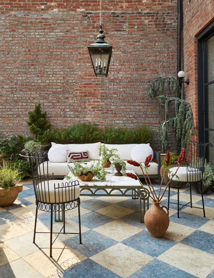 Such a gorgeous patio and outdoor seating area! I'm in love with that checkerboard tile floor and doesn't that outdoor sofa look amazingly comfy! The perfect spot to spend a weekend! Love! Eyeswoon - patio decorating ideas - patio ideas - outdoor living - patio furniture - patio seating 