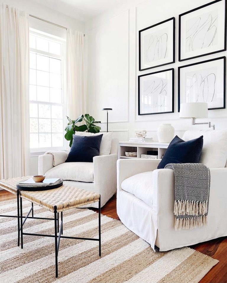 Two white swivel chairs and striped rug in white living room - jane at home