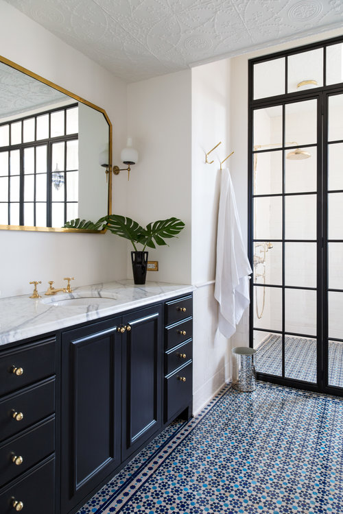 I've been gathering inspiration for our upcoming master bathroom remodel, and this beautiful space caught my eye!  So many wonderful and inspiring details here!  I love the custom steel and glass shower enclosure, the mirror, and that amazing patterned tile floor! bathroom remodel - bathroom ideas - bathroom design - bathroom decor - master bathroom