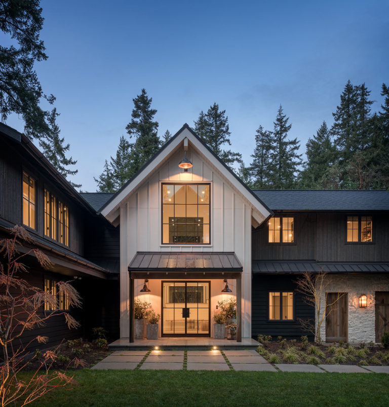 This home is beyond dreamy. The mix of white and black exterior siding, natural stone, and warm woods, as well as the beautiful landscaping, are just stunning!! home exterior - iron ore sherwin williams - architecture - home design - exterior landscaping - modern farmhouse - house design