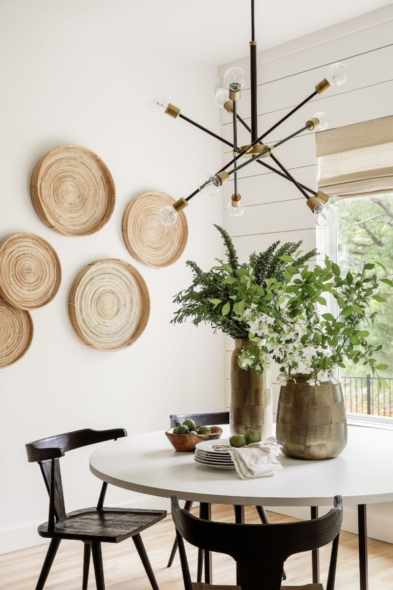 Such a fresh and pretty dining nook! I love the baskets on the wall, as well as the modern light fixture and shiplap detail - kitchen dining - dining nook - breakfast nook - dining room ideas - dining ideas - nook ideas