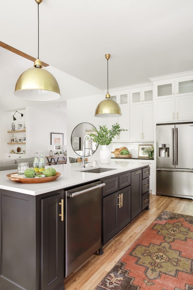Such a beautiful kitchen! Those gold dome pendant lights are amazing combined with the dark island color, white kitchen cabinets, and colorful vintage Turkish runner! kitchen ideas - kitchen lighting - island ideas - island lighting - kitchen decor - kitchen remodel - kitchen design