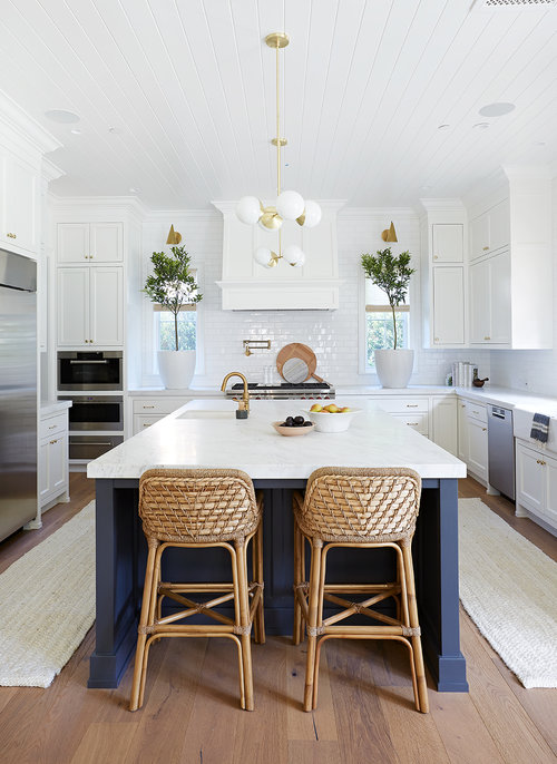 Love this beautiful modern kitchen design with a blue kitchen island, white kitchen cabinets, modern pendant lights, and woven counter stools - kitchen decor - kitchen remodel - blue and white kitchen 