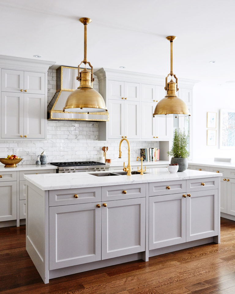 I love this gorgeous light gray kitchen with its center island and stunning brass pendant lights! kitchen ideas - kitchen remodel - grey kitchen - coastal kitchen - kitchen ideas - Allison Willson kitchen design
