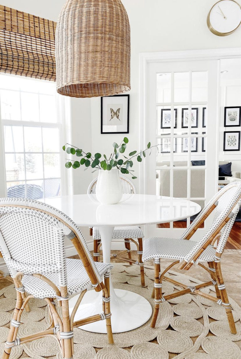 Our kitchen dining and breakfast nook, with bistro chairs, a woven pendant light and a white tulip table - jane at home