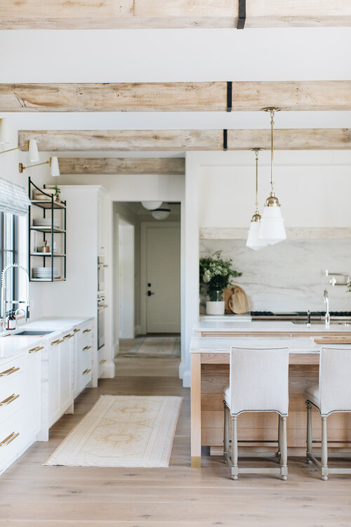 Such a beautiful kitchen! I love the light wood islands and beams, white kitchen cabinets and modern organic vibe - kitchen ideas - kitchen remodel