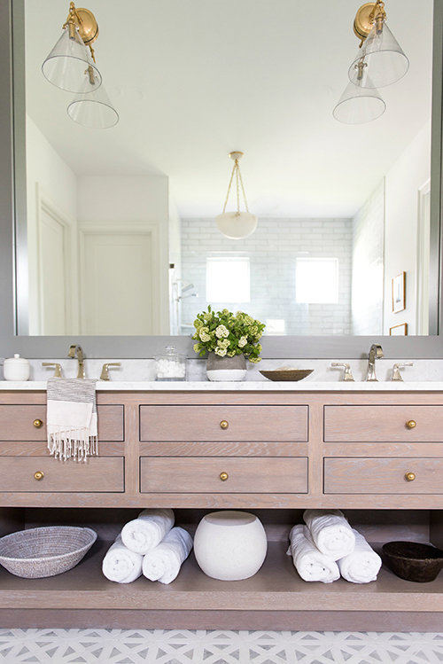 Beautiful bathroom with light wood vanity and brass accents - Whittney Parkinson - bathroom remodel