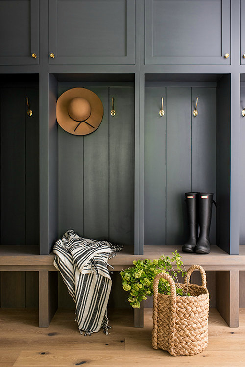 Stunning mudroom design with moody dark built in cabinets and shelves and vertical shiplap - Whittney Parkinson Interior Design