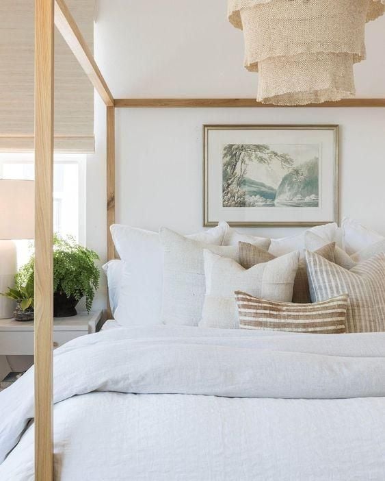 I love the light and airy feeling of this beautiful modern bedroom design with neutral furniture, bedding and decor - bedroom decor - bedroom furniture - bedroom lighting - modern coastal style - coastal bedroom - coastal decor - pure salt interiors