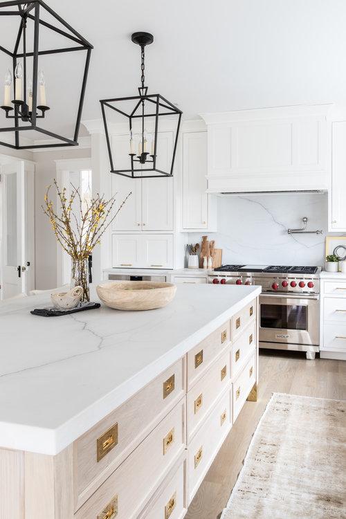 Love this stunning timeless kitchen design with light wood kitchen island and white cabinets - kate marker interior design