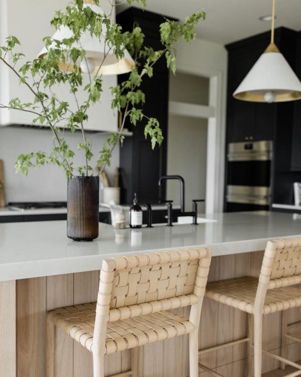 Love this beautiful modern kitchen design with a light oak wood island and woven counter stools - kitchen trends - fall trends - kitchen lighting - kitchen decor - kitchen island - oakstone homes