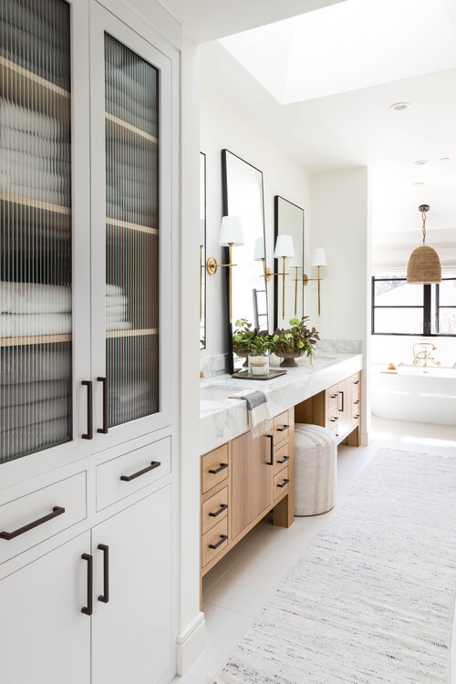 Love this beautiful modern master bathroom with a light oak wood vanity and white linen cabinet - bathroom remodel - bathroom cabinet ideas - bathroom vanity - modern bathroom ideas - coastal decor - coastal bathroom -- pure salt
