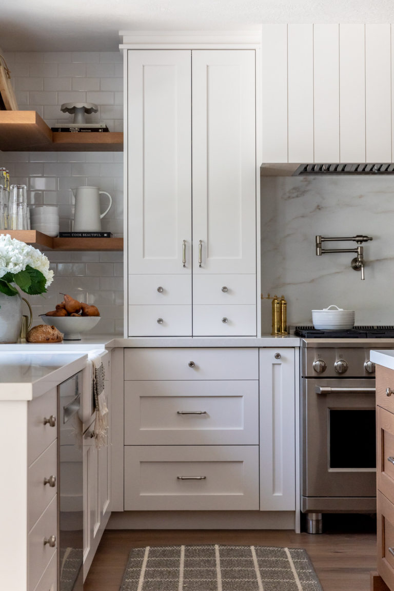 Love this beautiful kitchen design with white kitchen cabinets and shiplap range hood