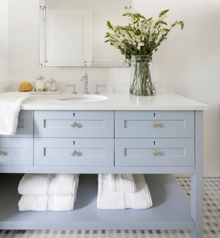 Such a beautiful bathroom design - I love the light blue vanity cabinet and modern coastal decor - bathroom remodel - coastal bathroom - blue bathrooms