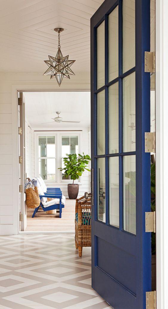 Love this beautiful entryway with a blue front door and diamond patterned tile flooring - jenny keenan design - clowney architecture